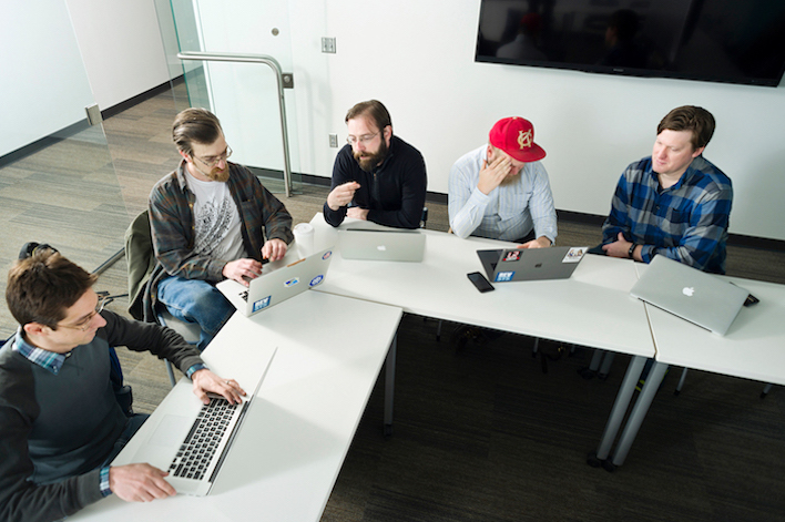 A REVSYS instructor working through Django material with a team